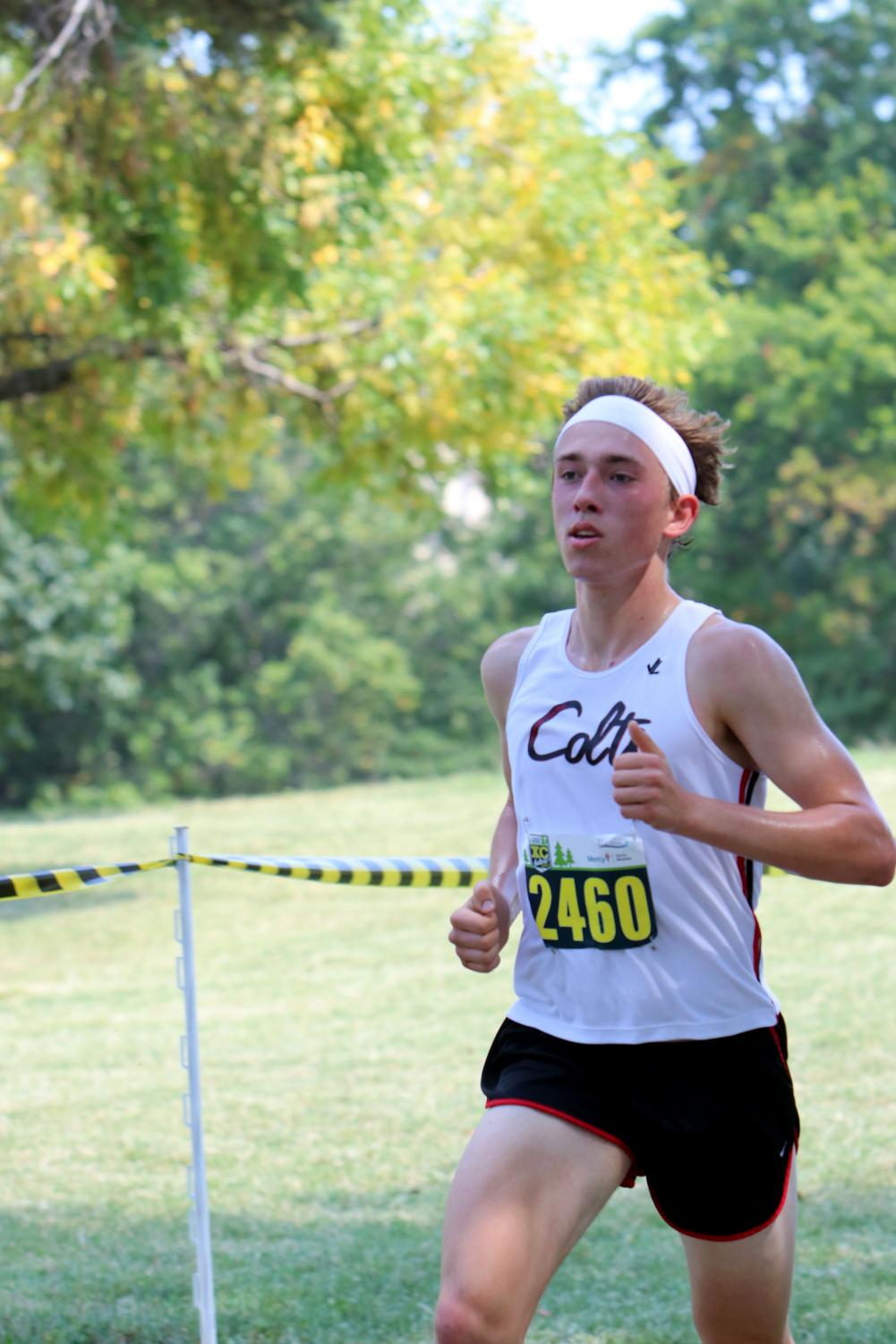Gottlieb Gerstenecker runs through the course at Forest Park Cross Country Festival on Sept. 9. Gerstenecker placed third place at the Festival out of 25 runners, getting the time of 17:28.62.