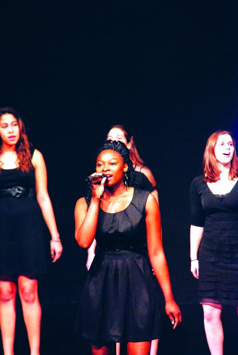 Akins blasts her vocals during a performance.