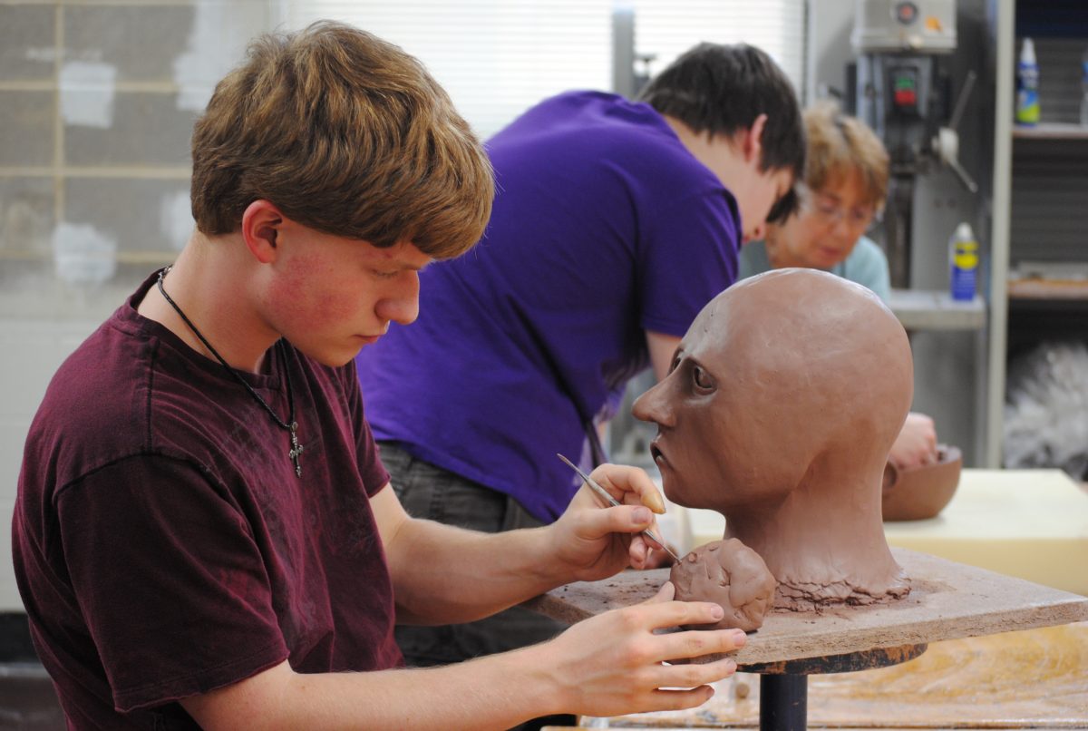 Patrick Clayton prepares an art project in Mr. Jafaris 7th Hour Sculpture class. Photo by Austin Dubinsky.