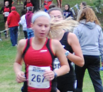 Freshman Kara Stark competes in the Suburban Conference meet at Forest Park. Photo by Brandon Fenton.