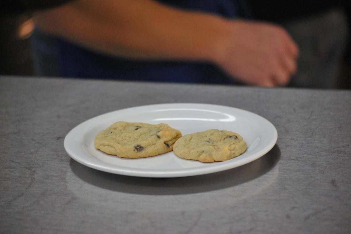 Students in Kitchen 1 of Mrs. Grabows 6th hour Culinary Arts bake these white and dark chocolate chip cookies for the chocolate chip cookie contest. Photo by Austin Dubinsky.