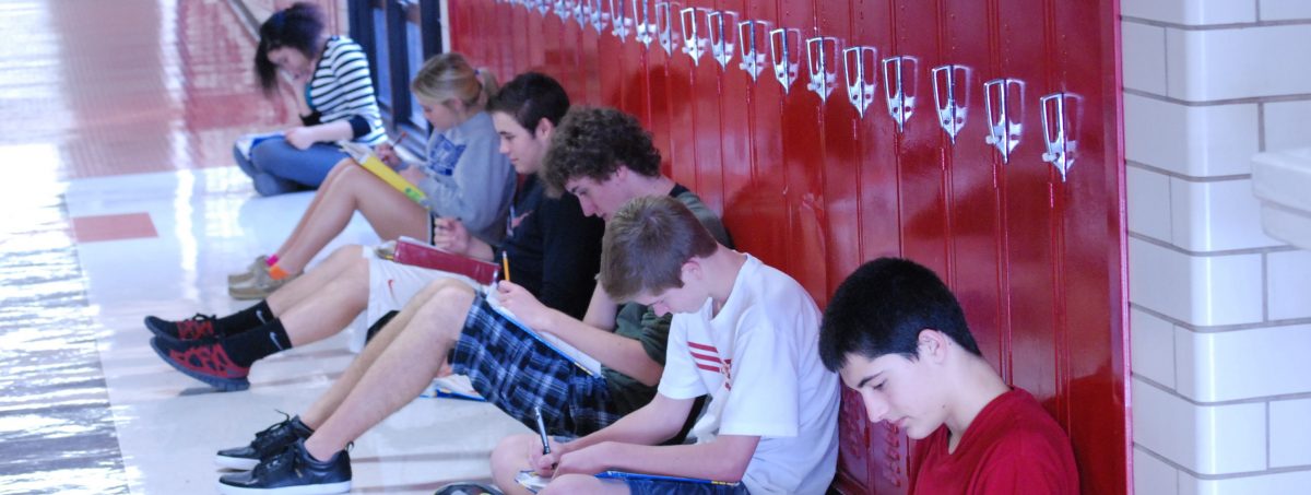 Students relax in the hall while studying Spanish.