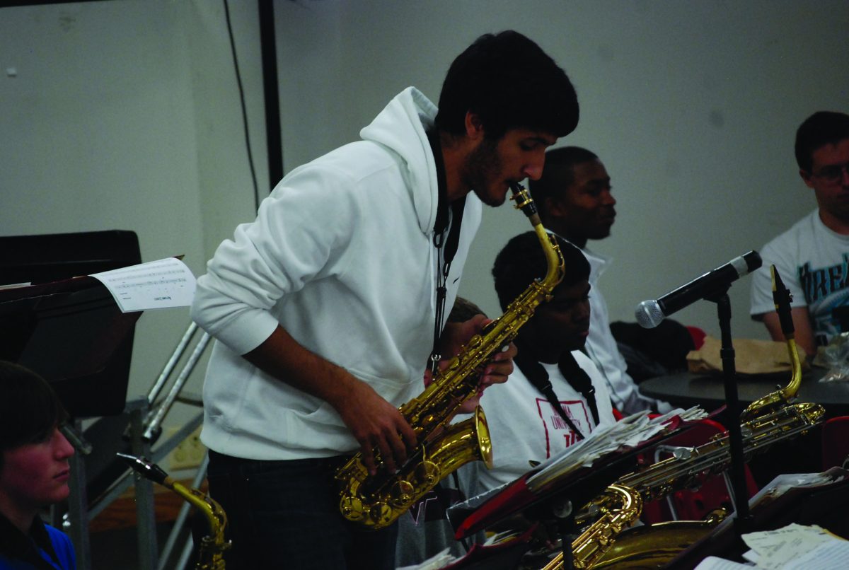 Senior Pajmon Porshahidy, practices the saxophone in jazz band class. The band was practicing for their concert on Dec. 11. Photo by Lillie Wasserman