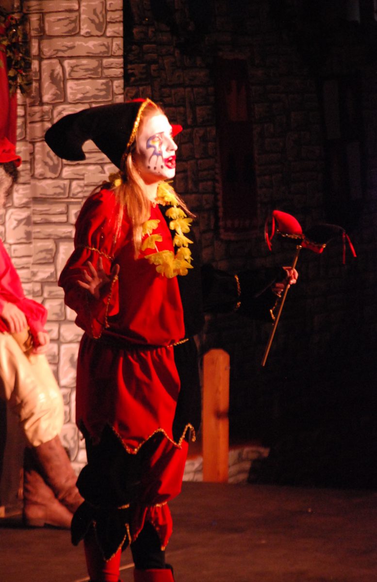 Senior Karlie Pinder performs in her last Madrigals, performing as the jester. She will be attending The American Academy of Dramatic Arts in New York City next year. Photo by Tara Stepanek.