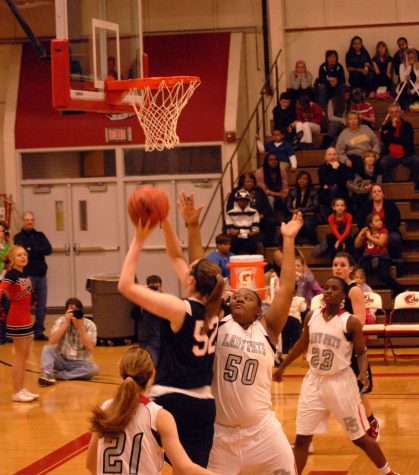 Zoe Wallis goes up for a lay up against Parkway South. Photo by Sam Winter