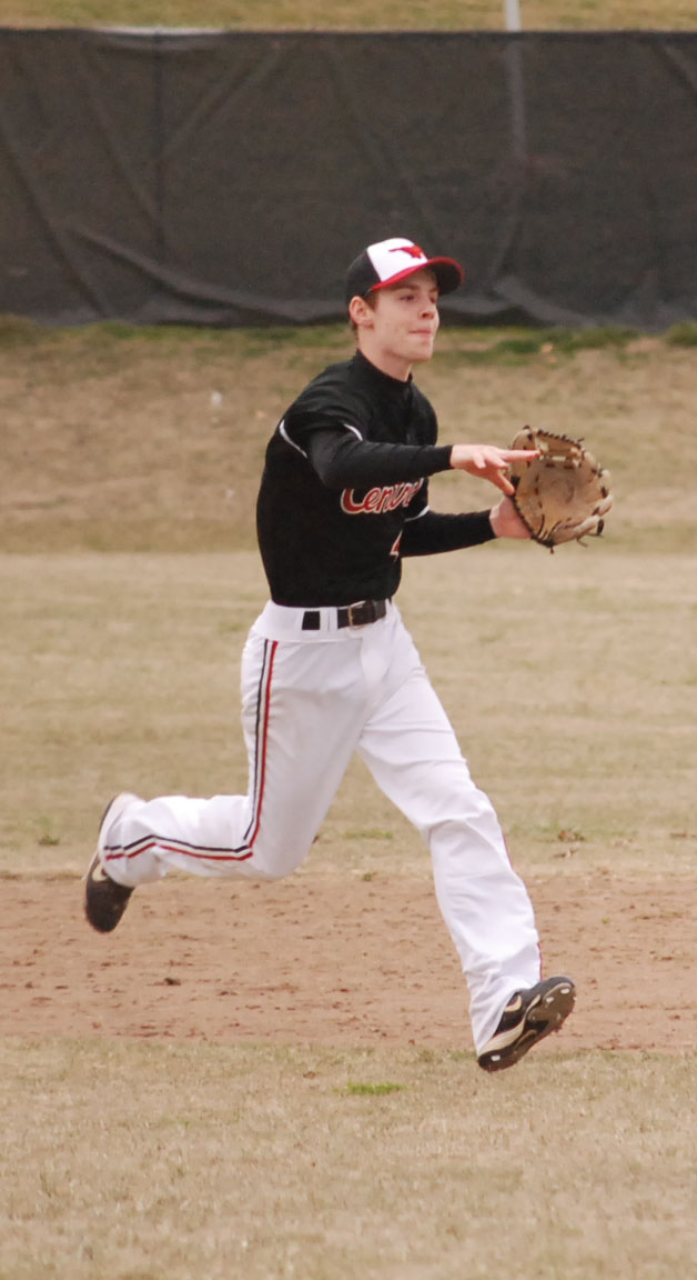 Jonathan Brand throws to first base in a game March 15 against Howell Central.  Photo by Tara Stepanek.