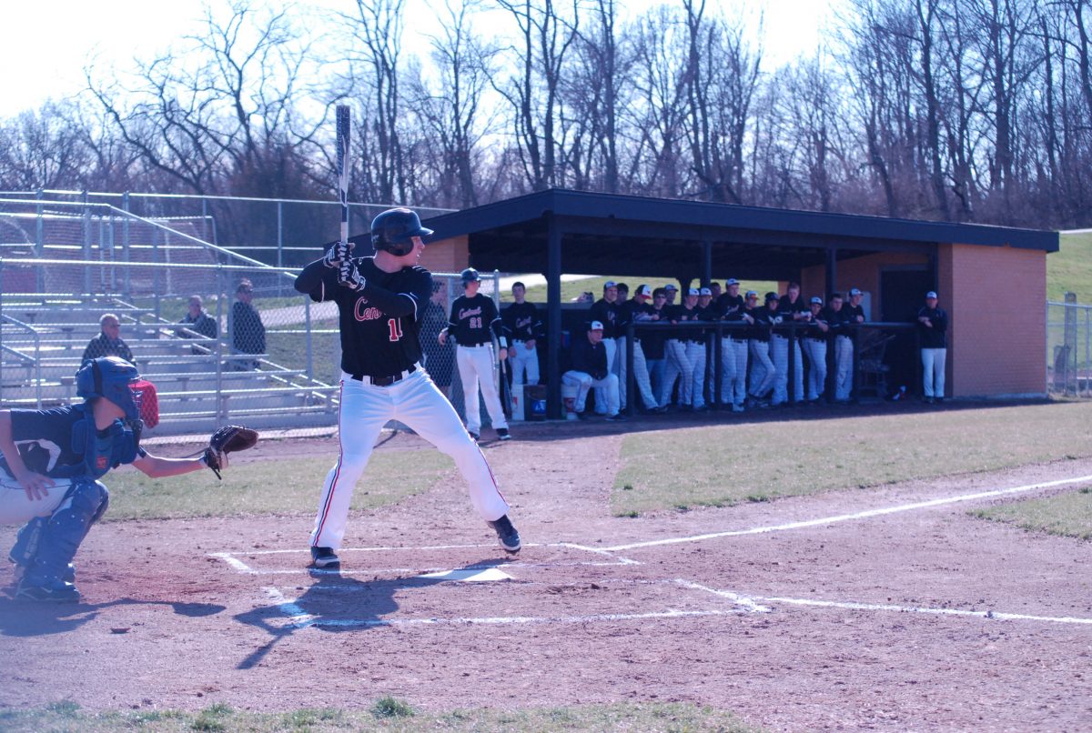 Senior Jack Schneider prepares for an incoming pitch from the St. Charles pitcher during a game on April 1. Photo by Emily Schenberg.