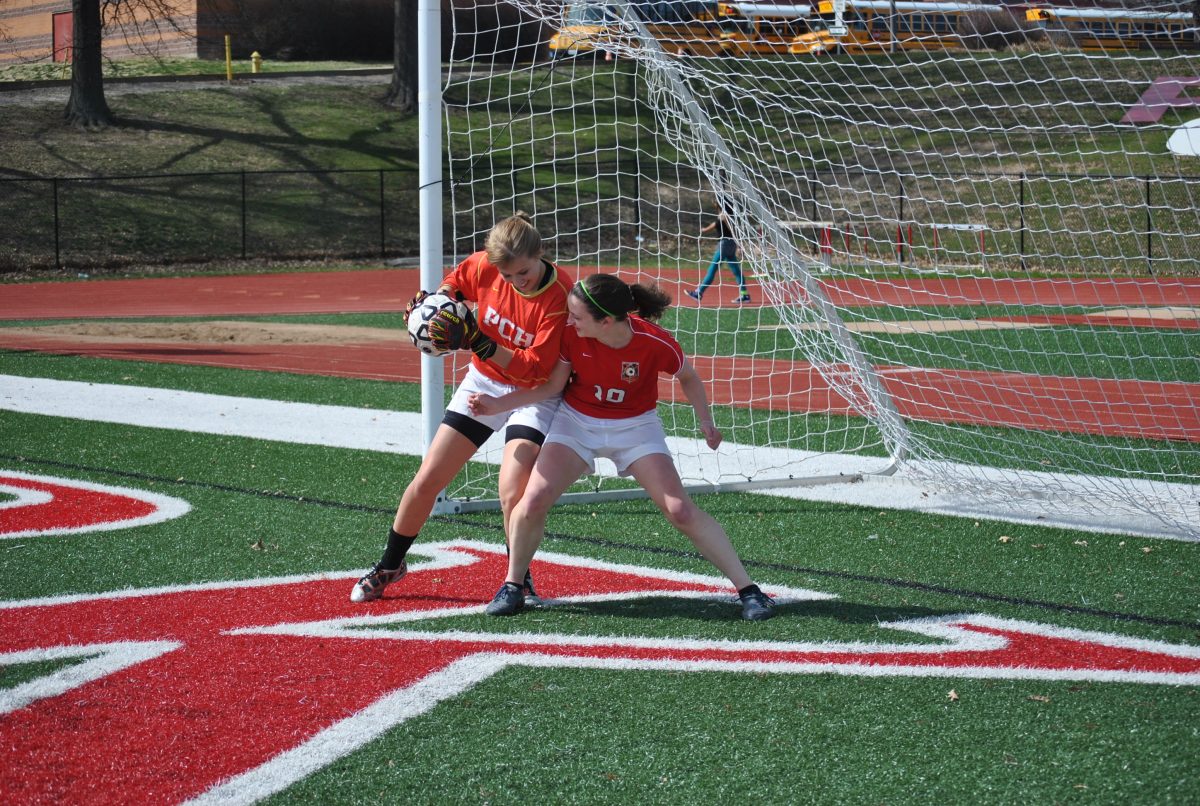 Sydney Stephens and Erin Roepke have been soccer teammates for over a decade, but next year they will become college rivals.  Photo by Mia Kweskin.
