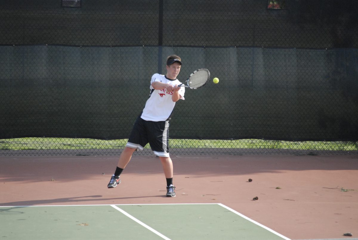 Ryan Fidell competes against Webster Groves. The Colts defeated the Statesmen 9-0 in their second sweep in as many matches. Photo by Nathan Kolker.