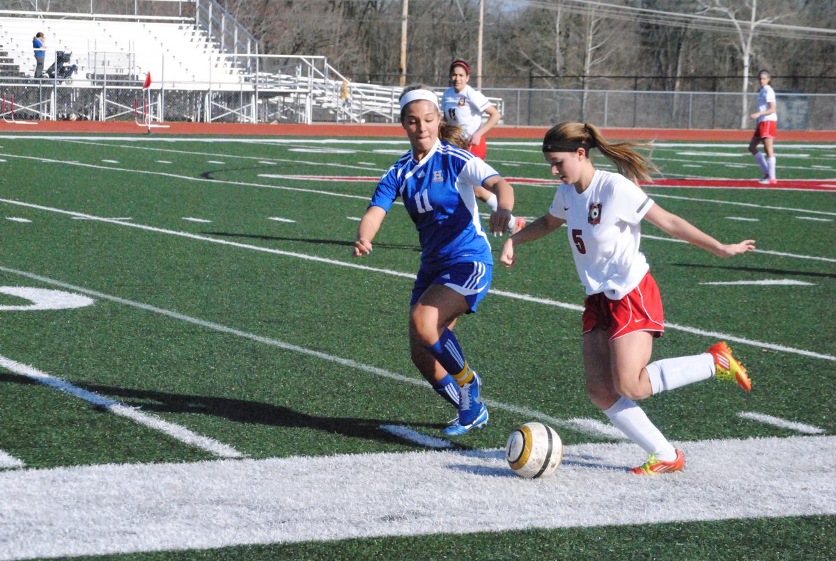 Sophomore, Gracie Devasto moves the ball up the left wing in the first half. Photo by Nathan Kolker