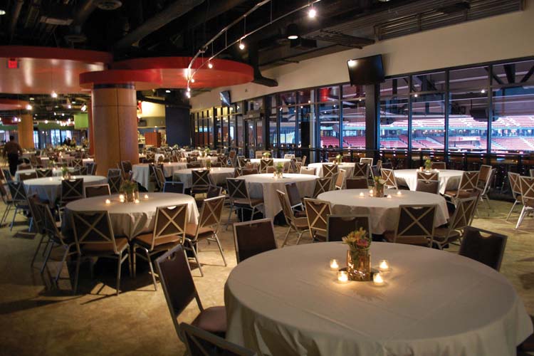 The seating area of the Redbird Club is a spacious area with a view of the field.