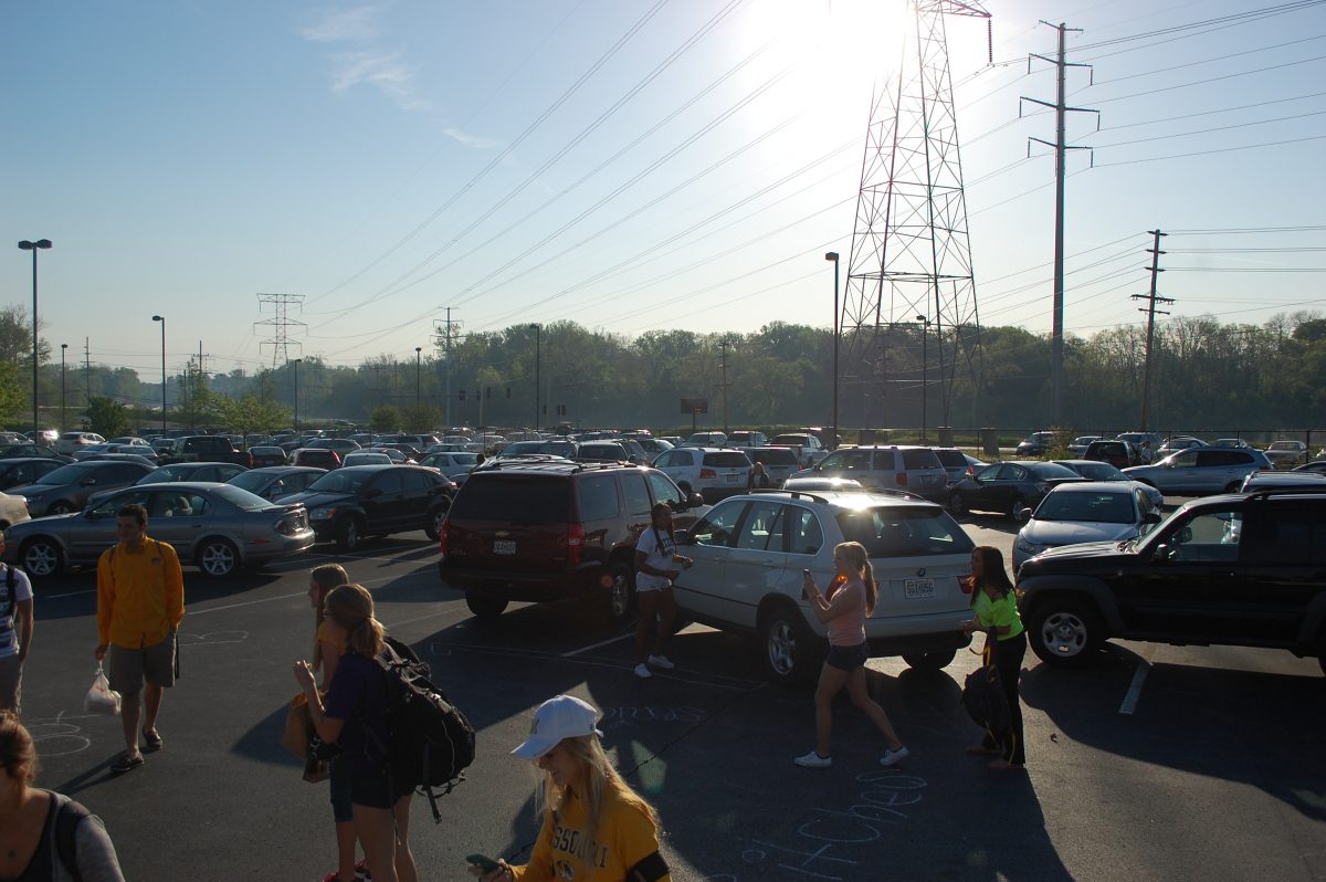 Seniors walk into school after parking their cars awry in the parking lot for a senior prank. Photo by Austin Dubinsky.