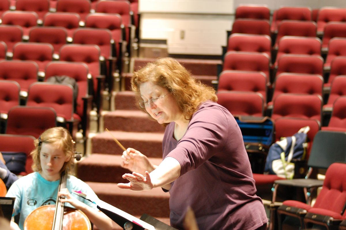 Mrs. Crock helps prepare the Orchestra for the Spring Concert.  She was awarded the prestigious award by the St. Louis Symphony for her dedicated teaching and love of music.  Photo by Austin Dubinsky.    