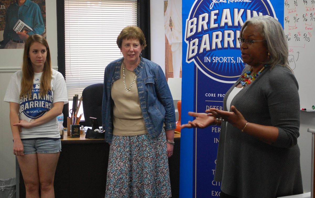Sharon Robinson speaks in front of Cindy Krones 6th block English I Class before she gives the Breaking Barriers essay writing contest Grand Prize award to freshmen Jennifer Wayland. Photo by Austin Dubinsky.
