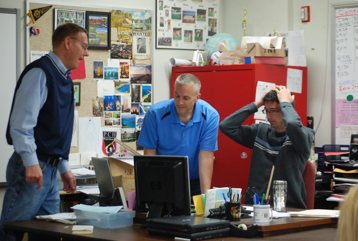 Mr. Tom Sellers, Mr. Keith Herberger, and Mr. Brian Adam complete one of their daily rituals of working together and picking on each other. Photo by Emily Schenberg