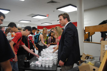 Principal Mr. Tim McCarthy surprises students at both lunches with free ice cream. The administration wanted to show their appreciation of the students cooperation during EOCs and other testing. Photo by Meaghan Flynn. 