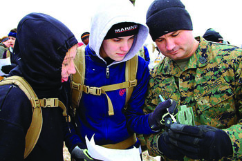 Katie Gates (middle) participates in a map-reading training exercise with the Marine Corps. She shipped out to boot camp on May 6. Photo courtesy of Katie Gates.
