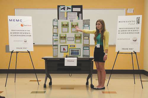 Senior Hannah Wiedner presents her project on BPA’s effects on living organisms to the Academy of Science St. Louis Science Fair. Photo courtesy of Hannah Wiedner.