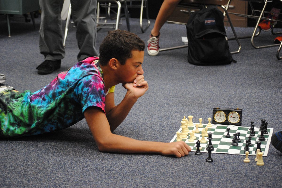 Mitch Weinstein (11) ponders a move while playing a game of chess in Mr. Dan Kelty’s room during Ac Lab. Photo by Jason Sobelman. 