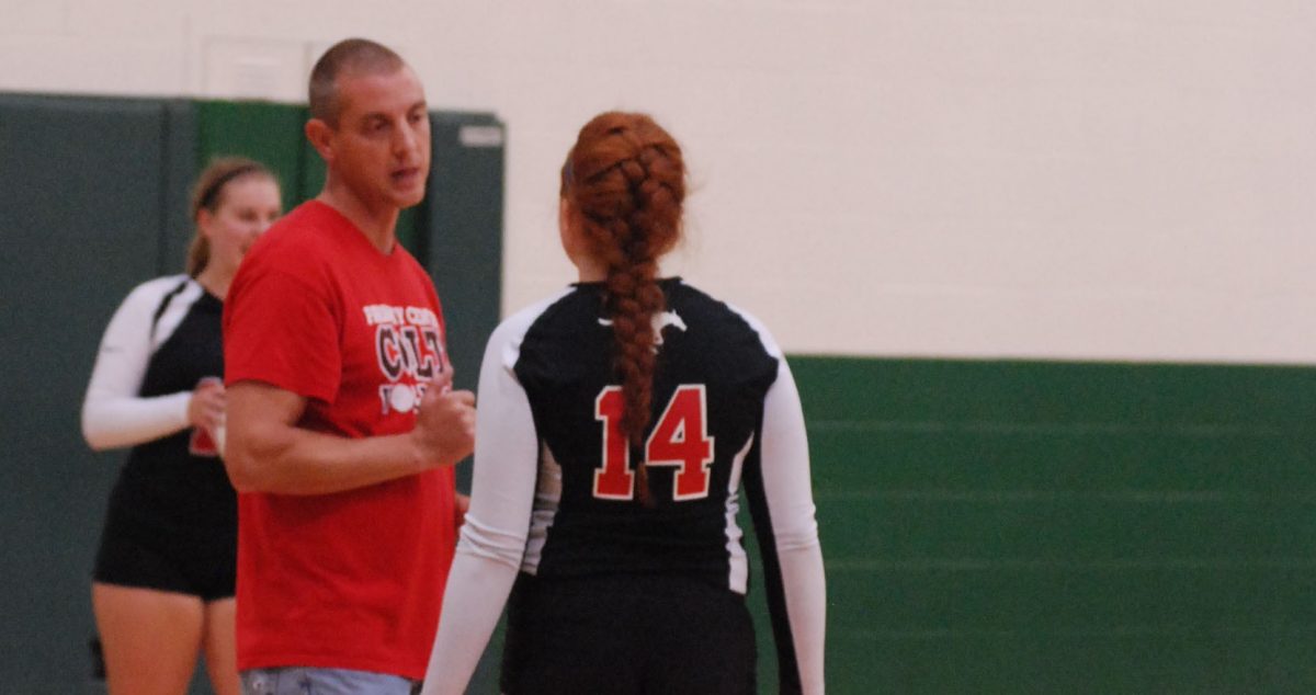 Varsity volleyball coach Mr. Tom Schaefer instructs junior Makenna Sadler during the game against Pattonville on Sept. 16. “We have a lot of good leaders this year,” Schaefer said. “The returning players help the new girls feel welcomed.” Photos by Tara Stepanek.