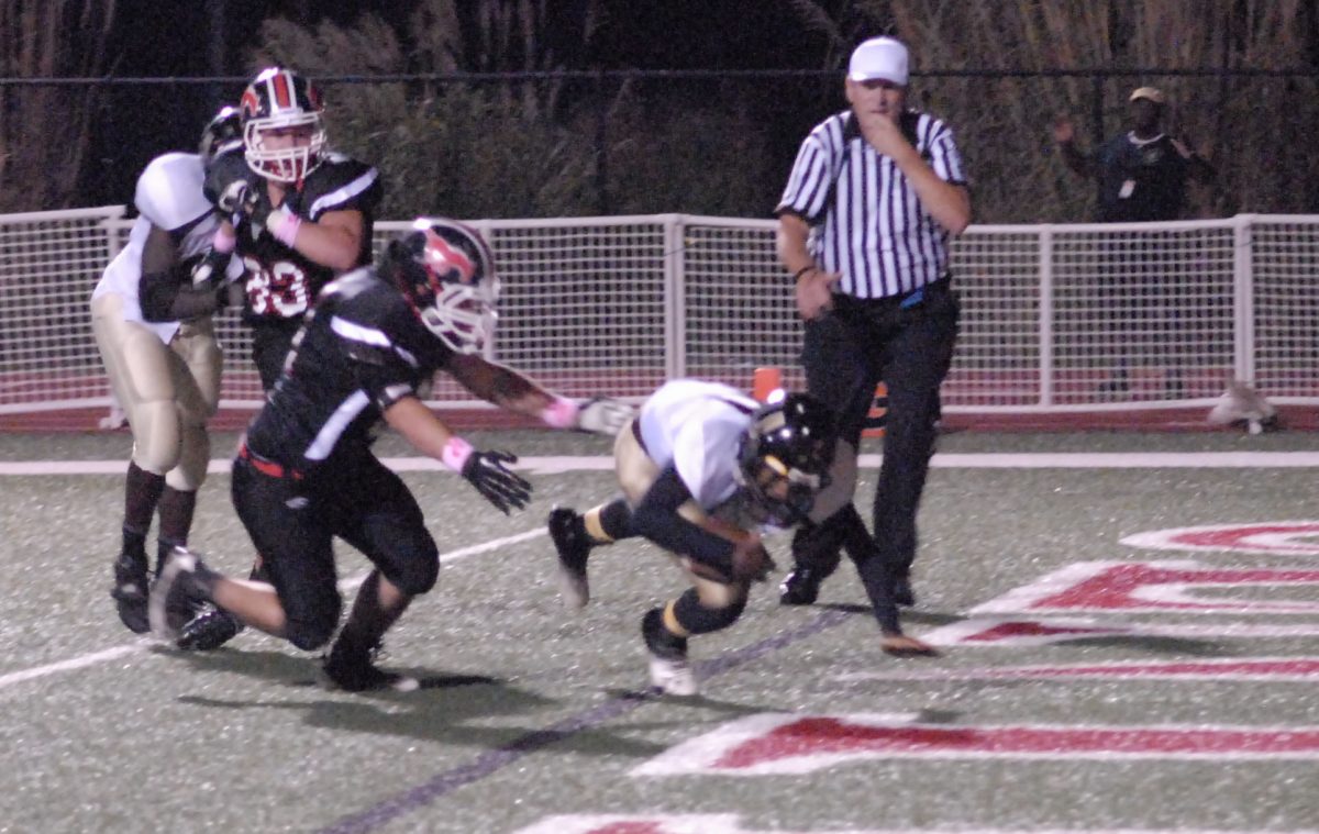 Senior David Rook tackles the U City quarterback into the end zone for a safety on Oct. 11. Photo by Yearbook staff. 
