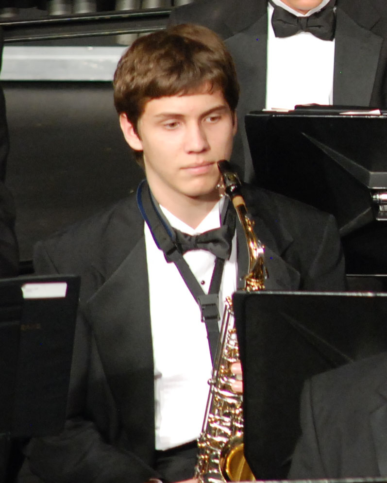 Junior Andrew Kirkham, saxophone, pauses while counting a rest in a concert band performance. Corral Archives.