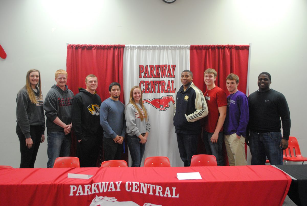 Zoë Wallis, Brady Feigl, Zach Rogers, Augie Brooks, Jessica Brady, Jonathan Bonner, Trey Knes, Johnny Naughton, Khalen Saunders attend a ceremony in which they signed their letters of intent. 