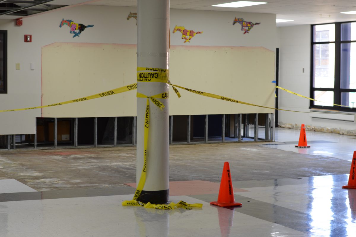 Water damage in the lower commons, near the school store and glass office suite, proves to be one of the worst places hit. Workers have ripped up tile here and the rubber baseboard to assess and fix damage.