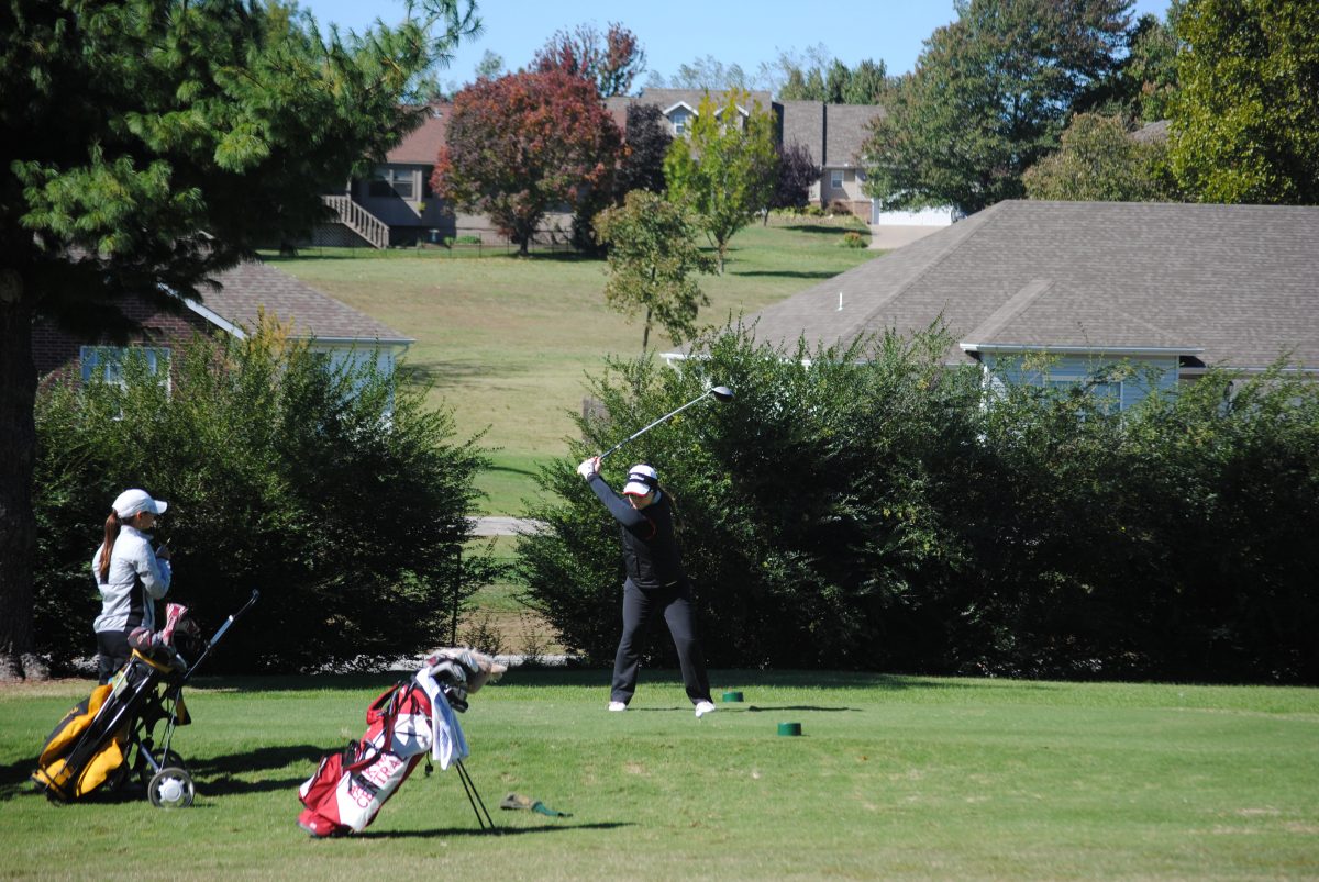 Senior Elizabeth Leath takes a tee shot at the State golf tournament on Oct. 14. Photo by Molly Pannett. 