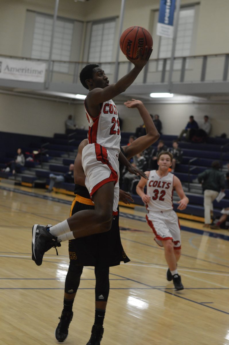 Floating in midair, Jarrett Cox-Bradley makes a layup against Festus in the Ameritime Tournament at Missouri Baptist on Jan. 28 in a 29-point performance. Cox-Bradley averages 30 points a game. Photo by Matthew Gibbs.