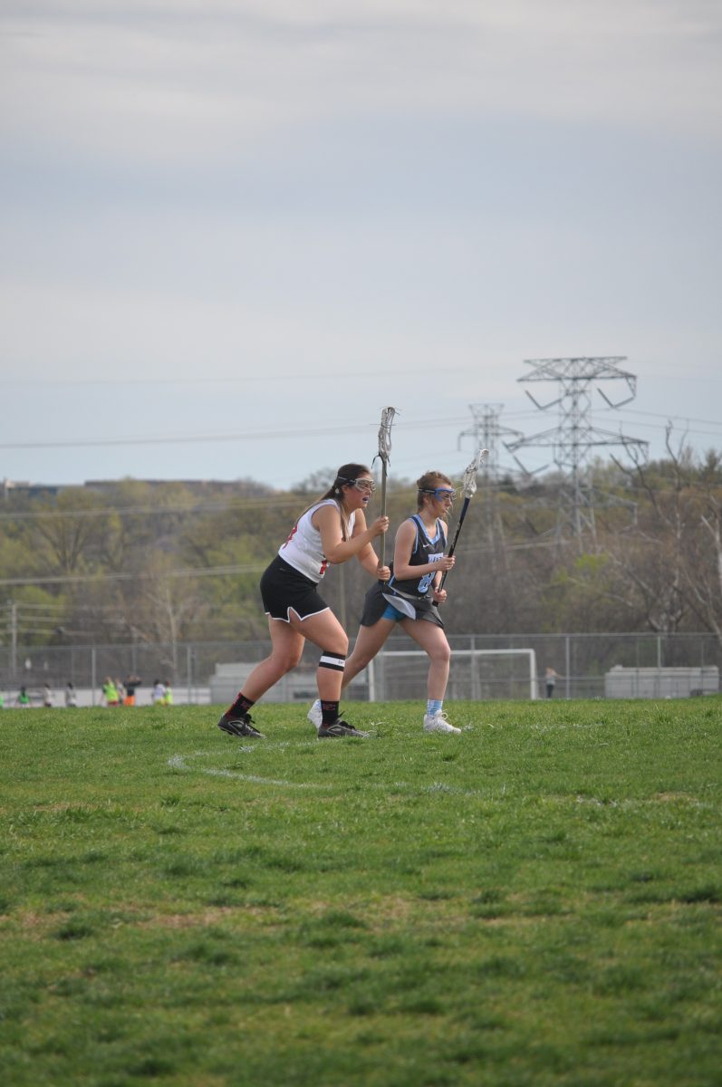 Senior Kathryn Rechenberg prepares to get the ball from the face off against Parkway West. Photo by Elizabeth Leath
