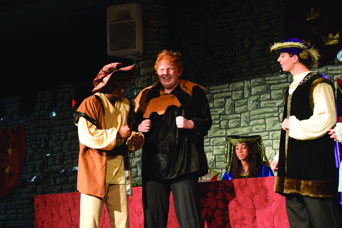 Junior Will Harold and senior Ben Scissors playing Italian insurance salesmen in the Madrigal performance on Dec. 11