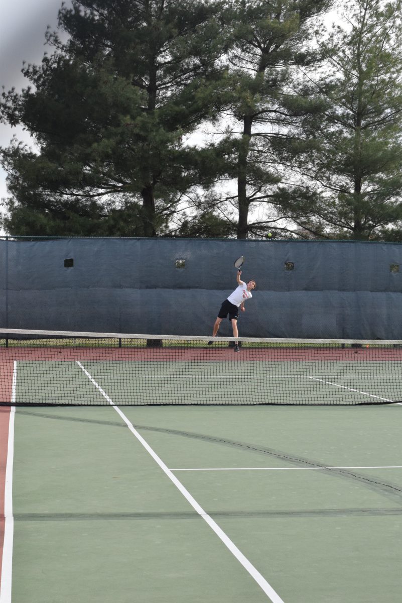 Jake Liebman serves to an oppenent in a match. Photo by Ms. Stepanek. March 5, 2016.