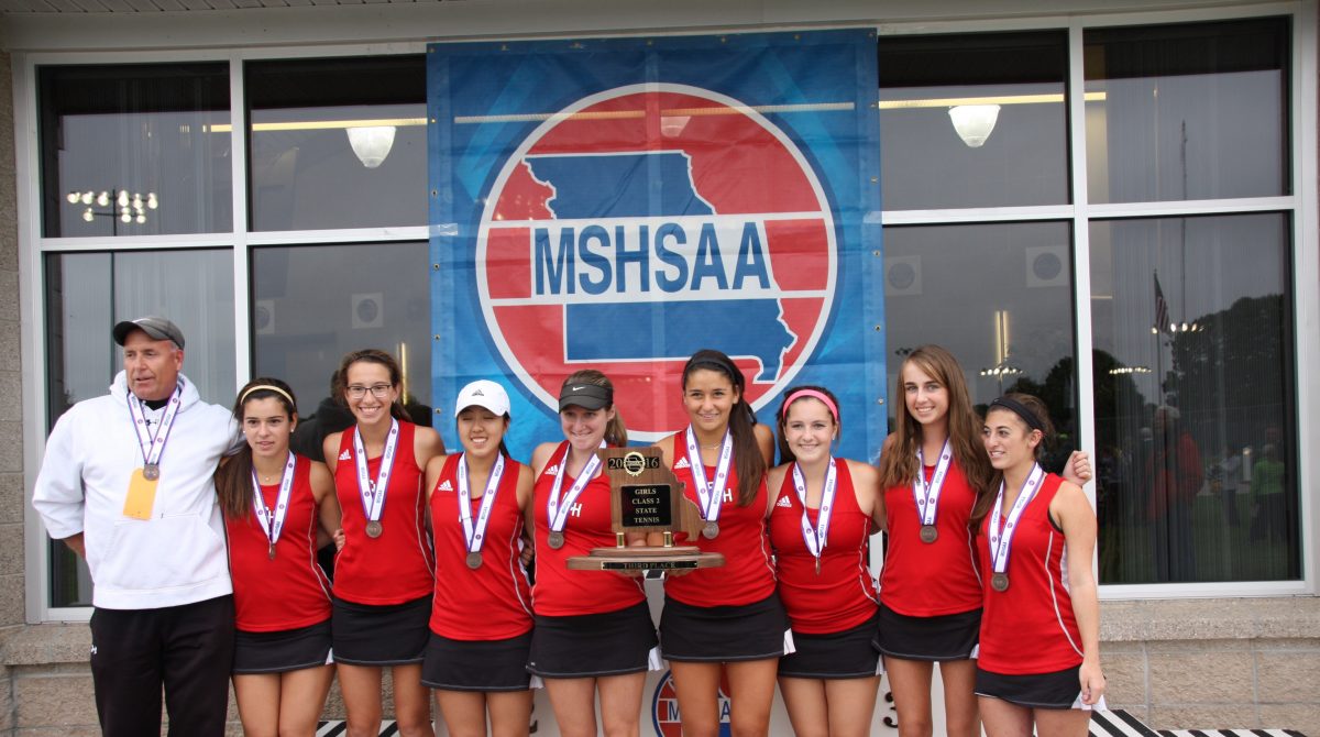 Head coach Lee Hays poses alongside Lexi Ecker, Michelle Korenfeld, Jessica Sun, Elena Wilner, Rebecca Davis, Zoe Hahn, Michelle Skroba, and Emily Miller as they hold up the MSHSAA third place trophy on Oct. 13 at the Cooper Tennis Complex in Springfield, Mo. “It’s the best feeling, knowing that all our hard work has finally paid off,” Ecker said. The girls said it was the perfect way for seniors Ecker, Sun, Wilner, Davis and Miller to end their high school careers.
