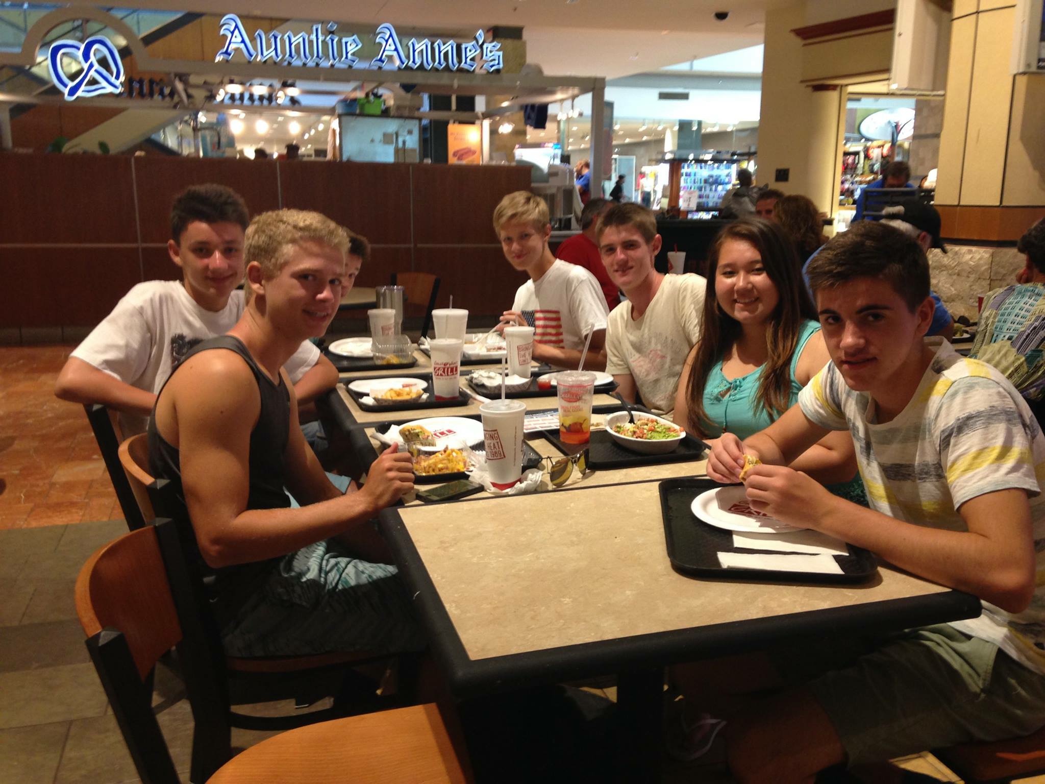 Exchange students Nicolas Gorres, Moritz Dittrich and Kai Borgen enjoy lunch time with host brother and sister, Patricia Rutherford and Spencer Hritz. Photo courtesy of Patricia Rutherford.