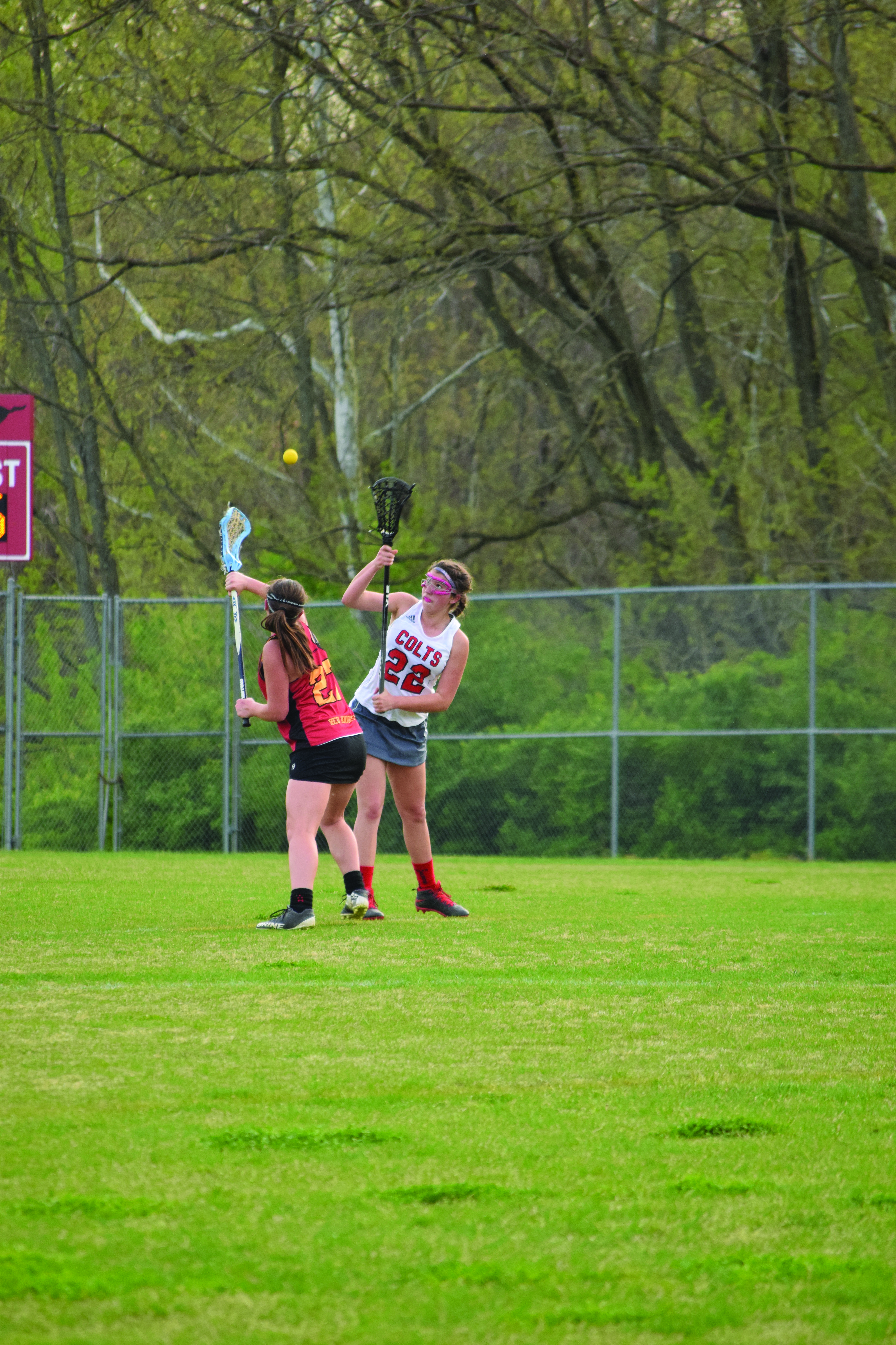 Freshman Brooke Lierman battles for the ball against an opponent from Incarnate Word Academy on April 13. “I think we will all be able to work together and I will have to have a bigger part in the leadership next year,” Lierman said. Lierman has scored 12 goals with only 22 shots, leading the team in shooting percentage. Photo by Tara Stepanek
