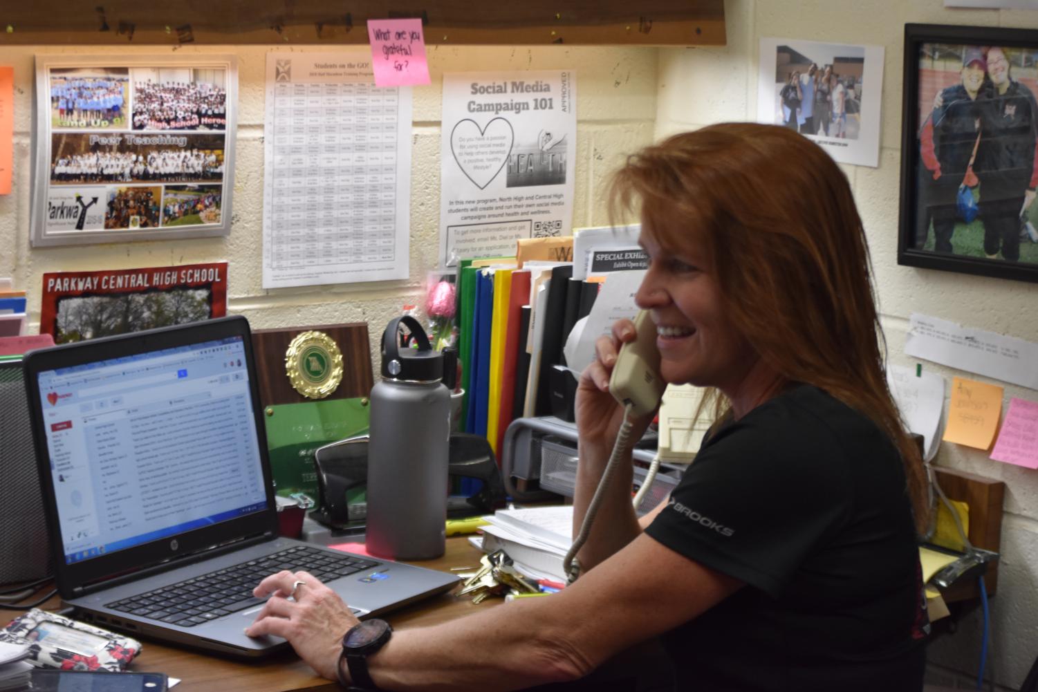 Physical Education Teacher Terri O'Leary conferencing with a parent.