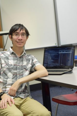 Justin Nguyen on his computer. Nguyen advises getting involved. He was a regular client of the chiropractic office he helped over spring break. Photo by Christine Stricker.