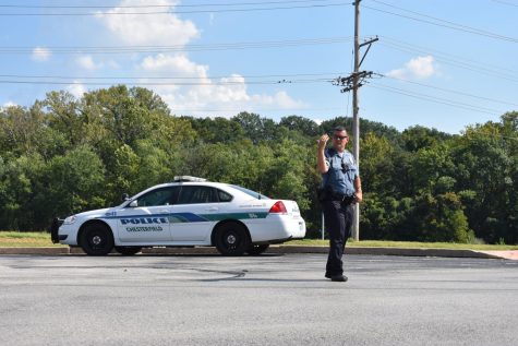 New School Resource Officer Travis Layton directs after-school traffic. This is on of the many duties an SRO will perform.