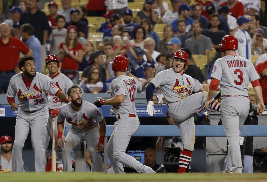 The St. Louis Cardinals’ Paul Delong (12) celebrates with teammates after hitting a two-run home run against the Los Angeles Dodgers in the ninth inning on Wednesday, Aug. 22, 2018, at Dodger Stadium in Los Angeles. The Cardinals won, 3-1. (Luis Sinco/Los Angeles Times/TNS)