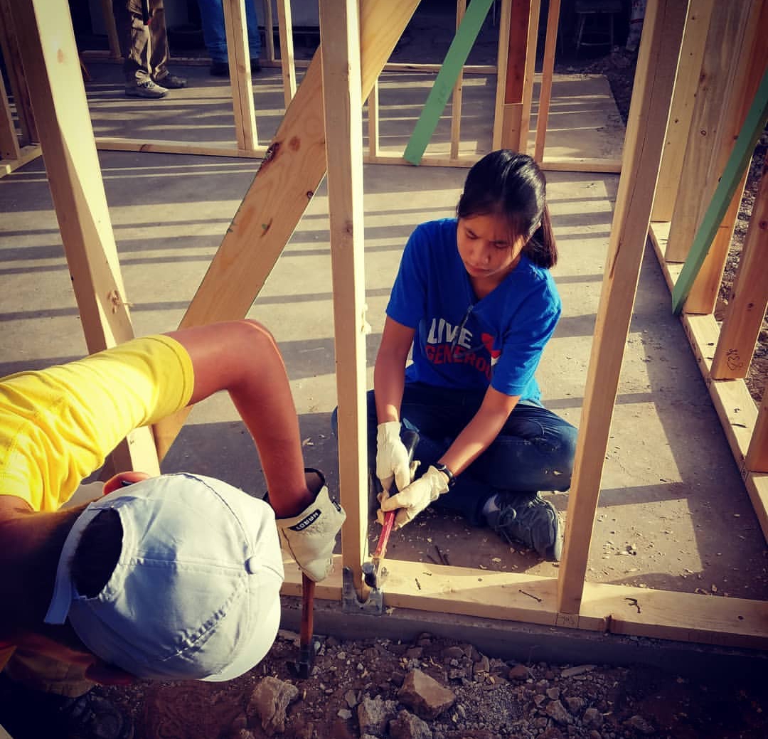  Tian Strege and fellow mission trip group member, working on building the home for a person in need living in Acuna, Mexico. Photo courtesy of Tian Stege.

