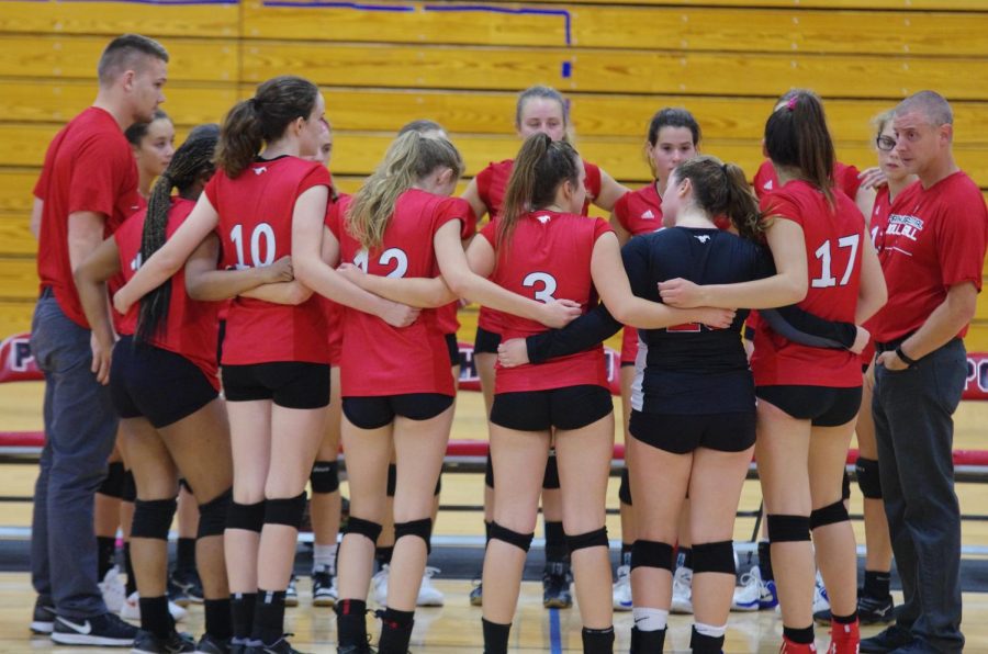  Head Coach Tom Schaefer directs his team against John Burroughs on Sept. 5. They eventually took the game 2-1. “The season was challenging, but rewarding,” Schaefer said.  “It was challenging yet really fun and overall a great experience,” Julia Hendricks (12) said.