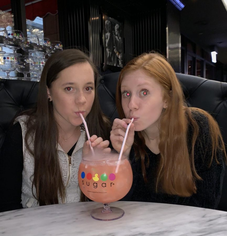 PCH Publications staff member sophomores, Sydney Stahlschmidt and Sydney Kolker, drinking The Watermelon Patch drink at The Sugar Factory during the journalism convention in Chicago.