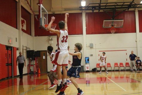 Sophomore Andrew Ahrens shoots against Parkway South, on November 26.