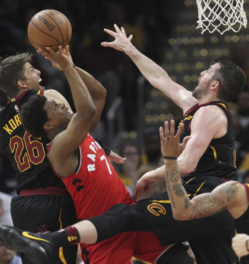 Toronto Raptors Kyle Lowry is smothered inside during the first quarter by Cleveland Cavaliers Kyle Korver (left) and Kevin Love in Game 4 of a second-round playoff series on Monday, May 7, 2018 in Cleveland, Ohio. (Phil Masturzo/Akron Beacon Journal/TNS)