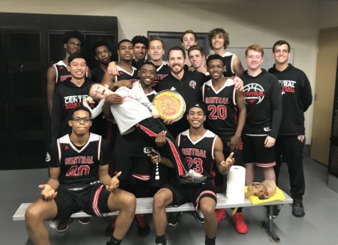 Mueller and his team pose with a cookie cake provided by Katie Mueller.