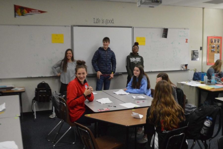 Link Leaders (background, left to right) Molly Wesolich (12), Jackson Sniff (11) and Makeeya Miller (12) help freshmen, such as (foreground, left to right) Jadyn Wallis (9) and Piper Douglas (9), deal with the things that cause them stress. The AC Lab played a game where everyone wrote a stressful thing on a piece of paper, crumpled it up, and threw them like snowballs. Each student then grabbed a random note and read it aloud to the class as the Link Leaders gave advice on how to deal with each issue.