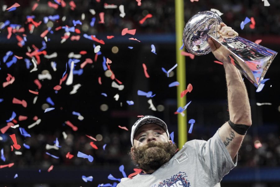 New England Patriots wide receiver Julian Edelman raises the Vince Lombardi Trophy after a 13-3 win against the Los Angeles Rams in Super Bowl LIII at Mercedes-Benz Stadium in Atlanta on Sunday, Feb. 3, 2019. (Curtis Compton/Atlanta Journal-Constitution/TNS)