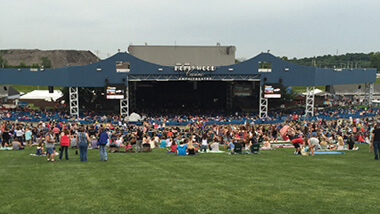 The amphitheater while in a live concert. Photo taken from the lawn seats.