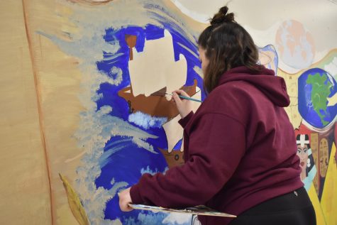 Karli works on her mural during Christmas break.